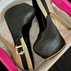 Womens stilettos size 7 run small by the half size. Box included. Wore once.